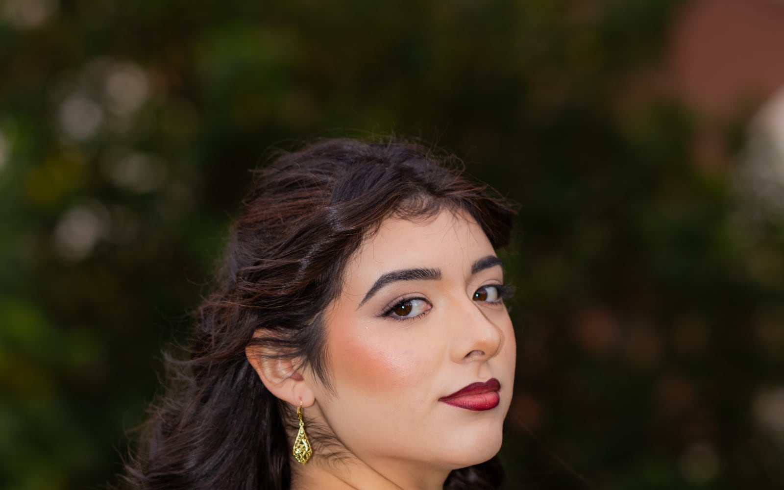 Editorial campaign portrait with warm gold details